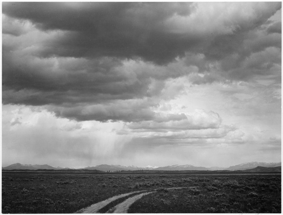 Roadway, low horizon, mountains, clouded sky, Near (Grand) Teton National Park,, 1933 - 1942 - NARA - 519911
