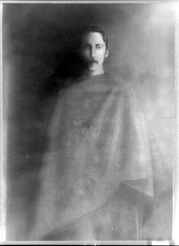 Robert Louis Stevenson, three-quarter length portrait, facing front, draped with cloth LCCN89706398
