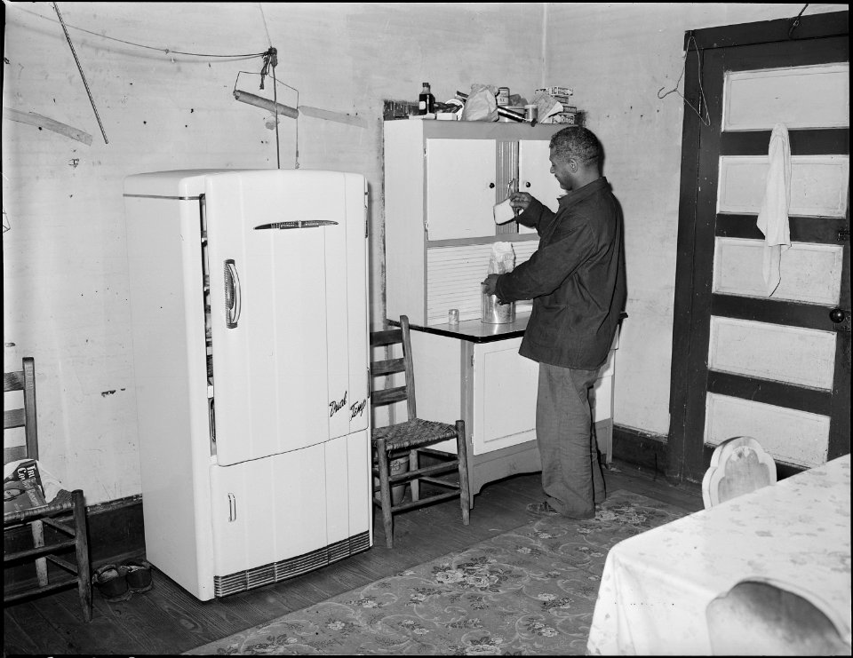 Robert Harold, miner, in his kitchen. He and his wife have lived in this house for sixteen years. For the four room... - NARA - 541055