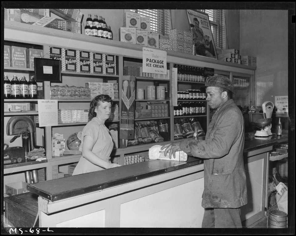 Robert Rose, miner, buying loaf of bread at company store. H. C. Frick Coal Company, National ^3 Mine, Muse... - NARA - 540251