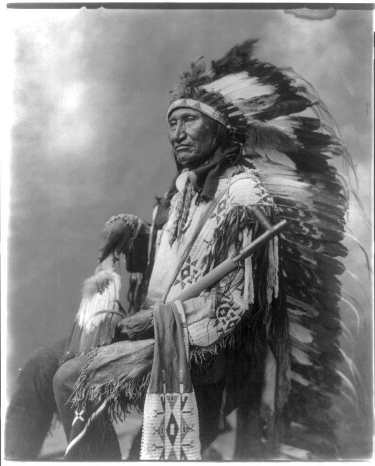 Rocky Bear, in deaddress, holding pipe LCCN2016647627