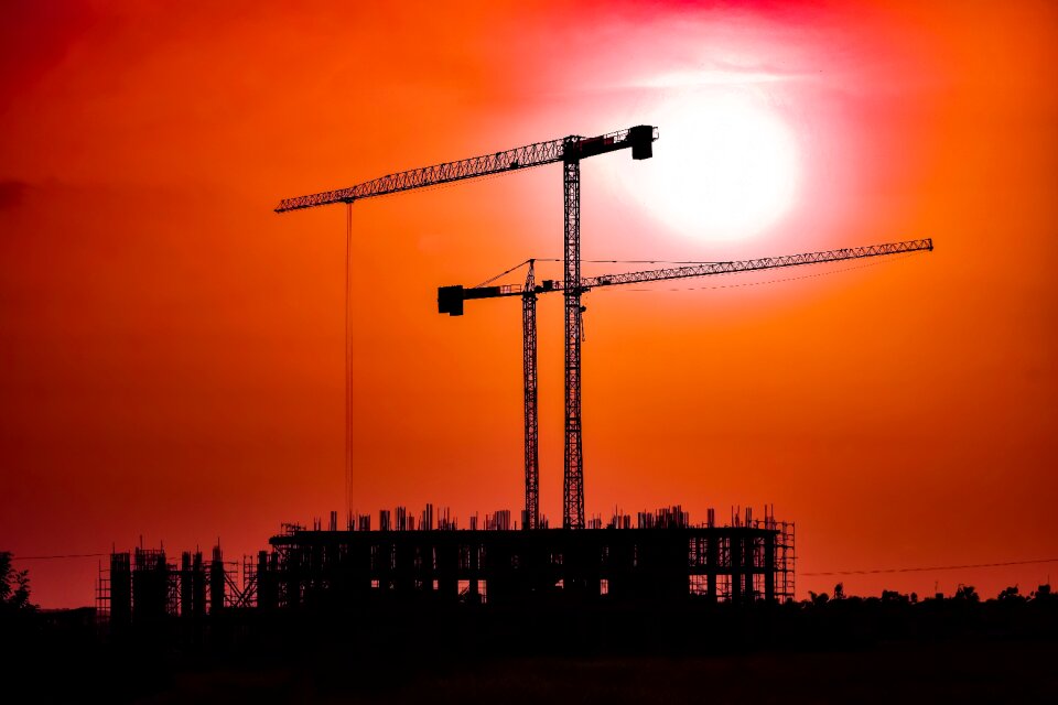 Silhouettes dusk construction site