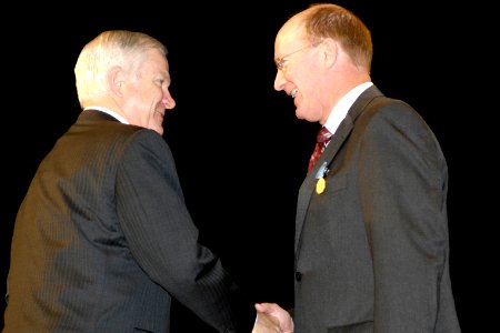 Robert M. Gates, left, congratulates Frank D. Kenlon, 21 October 2008