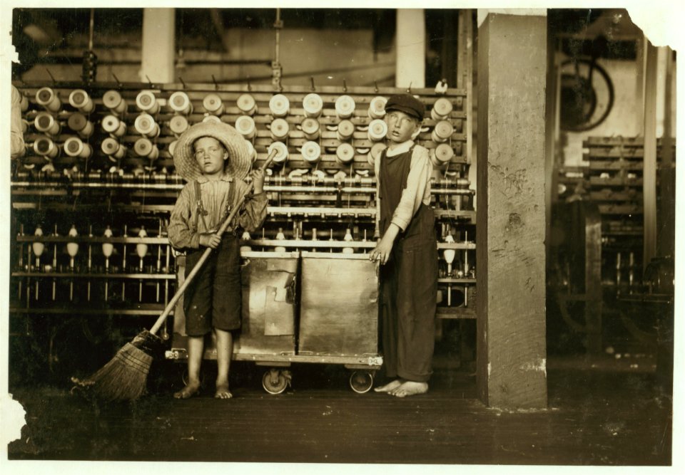 Ronald Webb, twelve year old doffer boy and Frank Robinson, seven year old who helps sweep and doff. Father is cardroom boss, Roanoke (Va.) Cotton Mills. LOC cph.3a20815