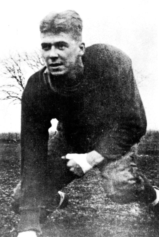 Ronald Reagan in football uniform on field at Eureka College in Eureka, Illinois
