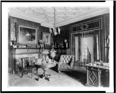 Room with plasterwork ceiling, fireplace, and circular table, in home of Edmund Cogswell Converse, Greenwich, Connecticut LCCN94502513 photo