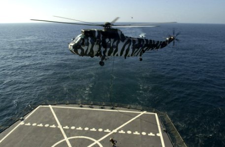 Royal Marines fast rope from Sea King to USNS Pecos (T-AO-197) 2002