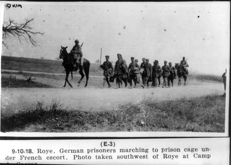 Roye (France). German prisoners marching to prison cage under French escort, southwest of Roye at Camp de Caesar, 10 Sept. 1918 LCCN2003662321