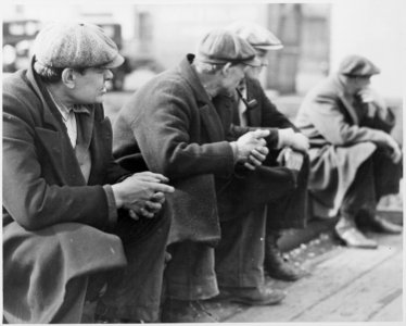 Row of men at the New York City docks out of work during the depression, 1934 - NARA - 518288 photo