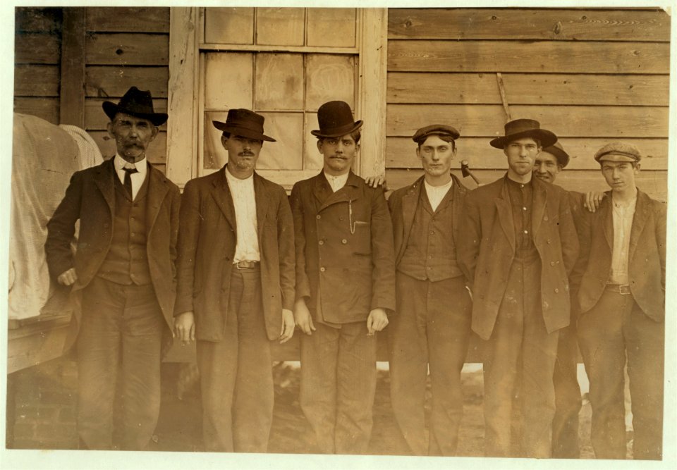 Row of mill men-Maple Mill, Dillon, S.C. Tallest man is the Baptist preacher J .H. Blanton. His son, the third from him, works in mill. LOC nclc.01483