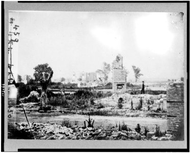 Ruins at Hampton, Virginia showing chimneys, and man standing LCCN91726136