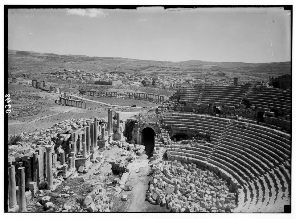 Ruins of Jerash (Gerasa). Jerash, south theatre and forum. Showing the entire forum from the theatre. Village in background. LOC matpc.02745
