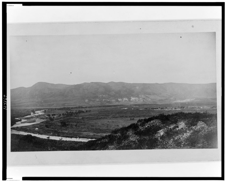 Ruins of village No. 20, south side, with the Verde River and Fort Verde shown in the distance LCCN99471775