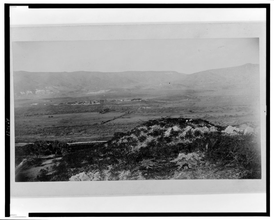 Ruins of village No. 20, from the southeast, with the Verde River and Fort Verde shown in the background LCCN99471776