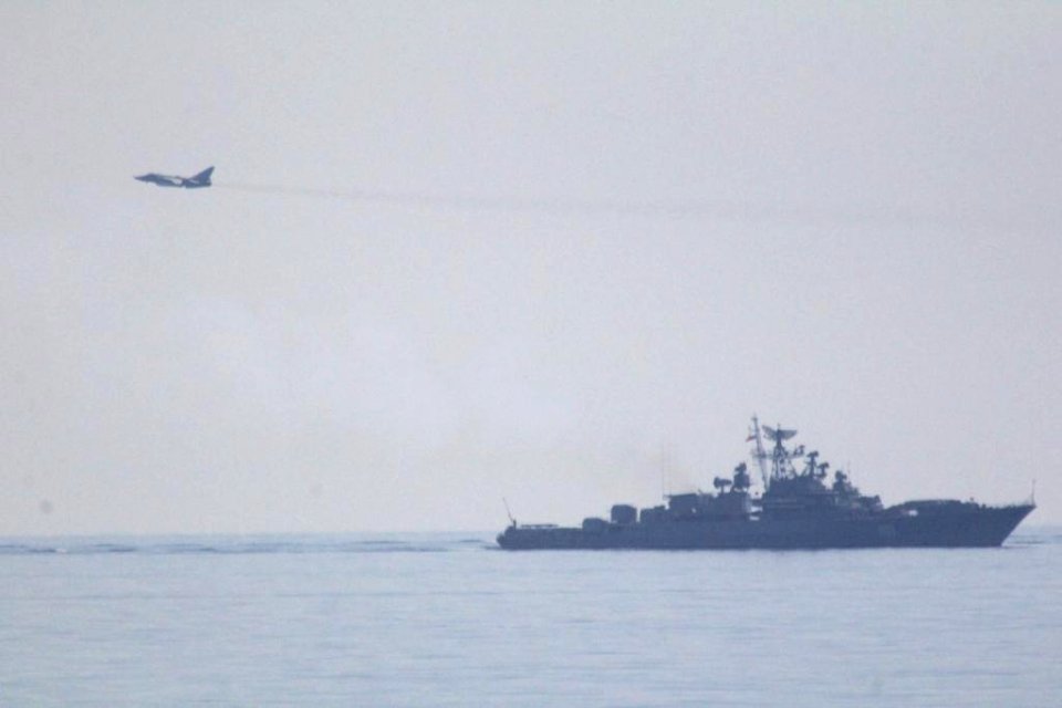 Russian Sukhoi Su-24 and Russian frigate Ladny