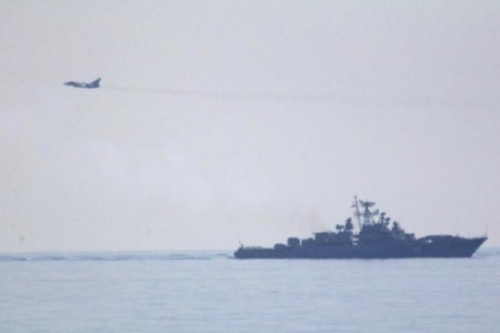 Russian Sukhoi Su-24 and Russian frigate Ladny photo