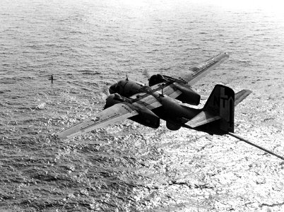 S-2E Tracker of VS-33 over submarine in February 1970