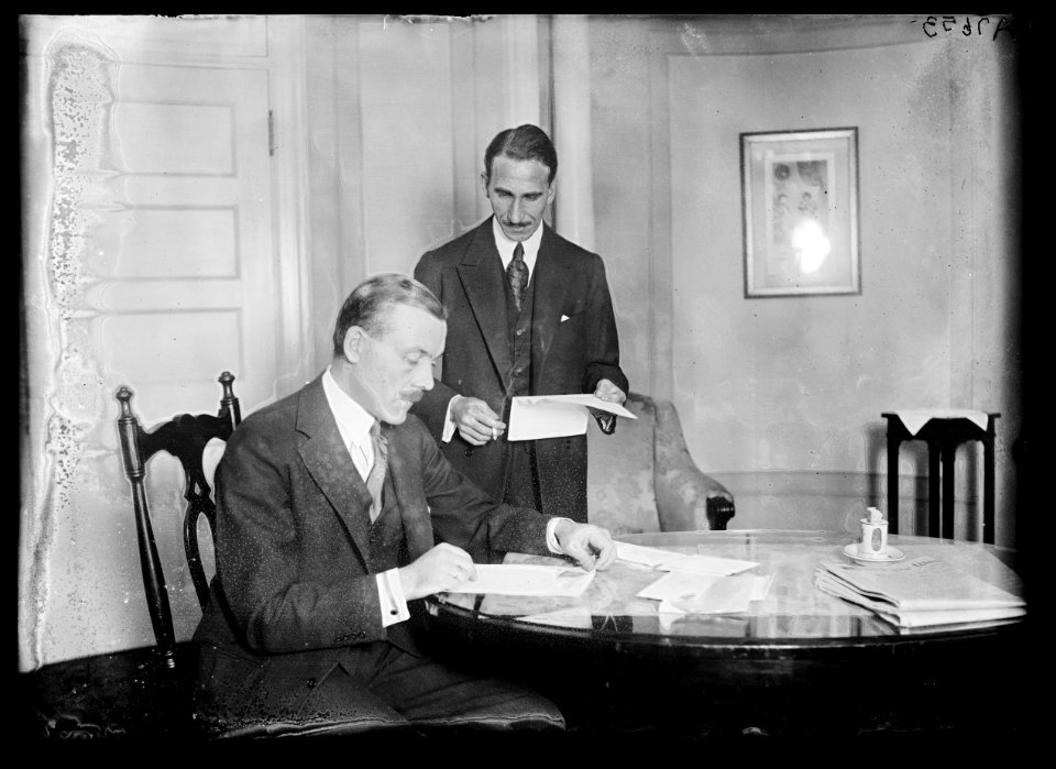 S. Yousry Pasha, seated, the 1st Egyptian Rep. Standing is A.M. Hassanein Bey, 1st Secy. to the Legation, who is well known on the continent as an explorer LCCN2016887055