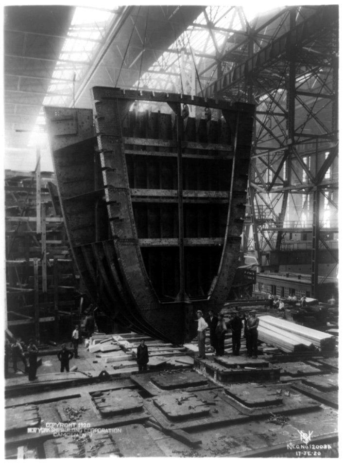 S.S. Nora. View showing 40 ton forward web frame, collision bulkhead and chain locker being put into place by cranes LCCN93515699
