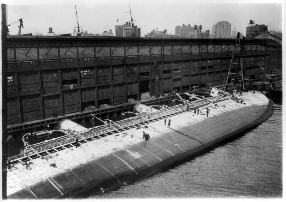 S.S. ST. PAUL as she lay on the bottom of the North River, New York City. Hull of raised ocean liner lying on its sie a pier LCCN2004665499