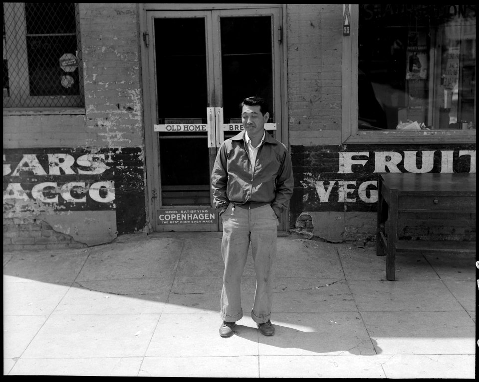 Sacramento, California. A resident of Japanese ancestry seen in front of the grocery store of which . . . - NARA - 537882