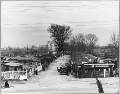 Sacramento, California. A view of Louis' Camp seen from across the road. Note crowding of structures . . . - NARA - 521725