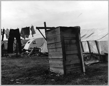 Sacramento, California. Close-up of one of 125 living units in squatter camps. The dismantled automo . . . - NARA - 521751 photo