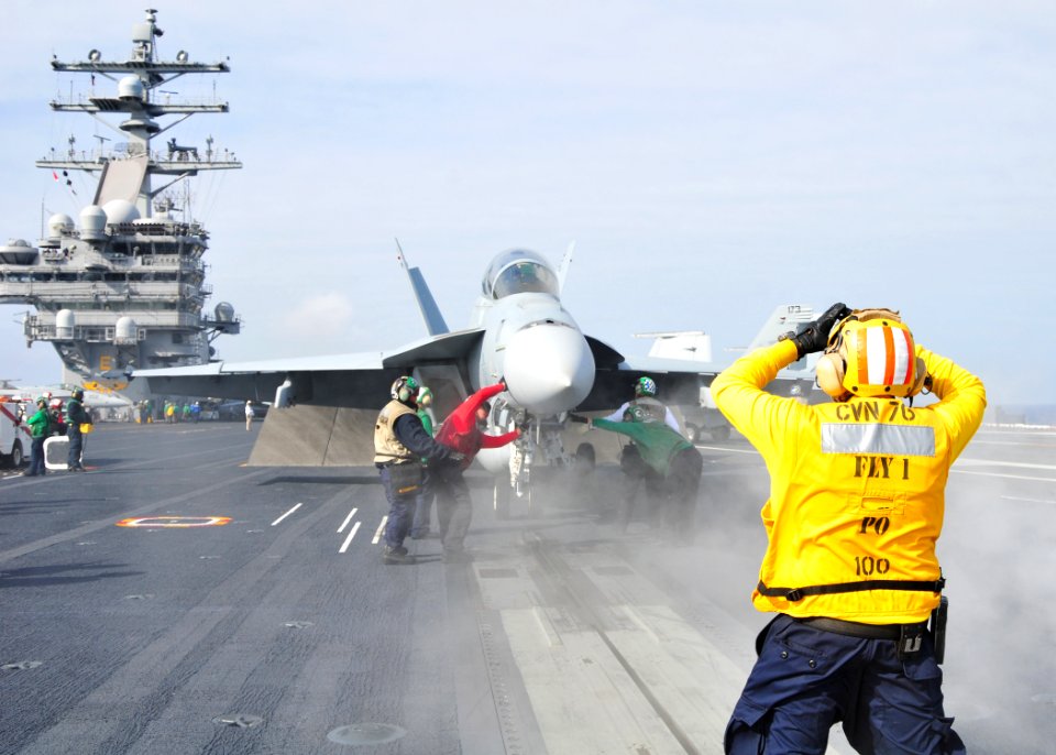 Sailor directs a Super Hornet at sea. (8719463949)