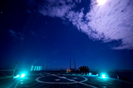 Sailors aboard USS Ross (DDG-71) conducting low-light gun shoot 151219-N-XT273-079