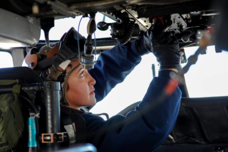 Sailor conducts Seahawk maintenance aboard USS Theodore Roosevelt 141103-N-CQ428-223