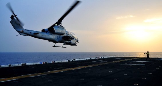 Sailor directs an AH-1 Cobra helicopter to take off from USS Boxer (5805296400)