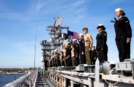 Sailors and Marines man the rails on the flight deck of USS Iwo Jima. (39440397114) photo