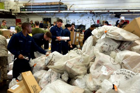 Sailors and Marines sort mail aboard USS Iwo Jima. (15751270674) photo