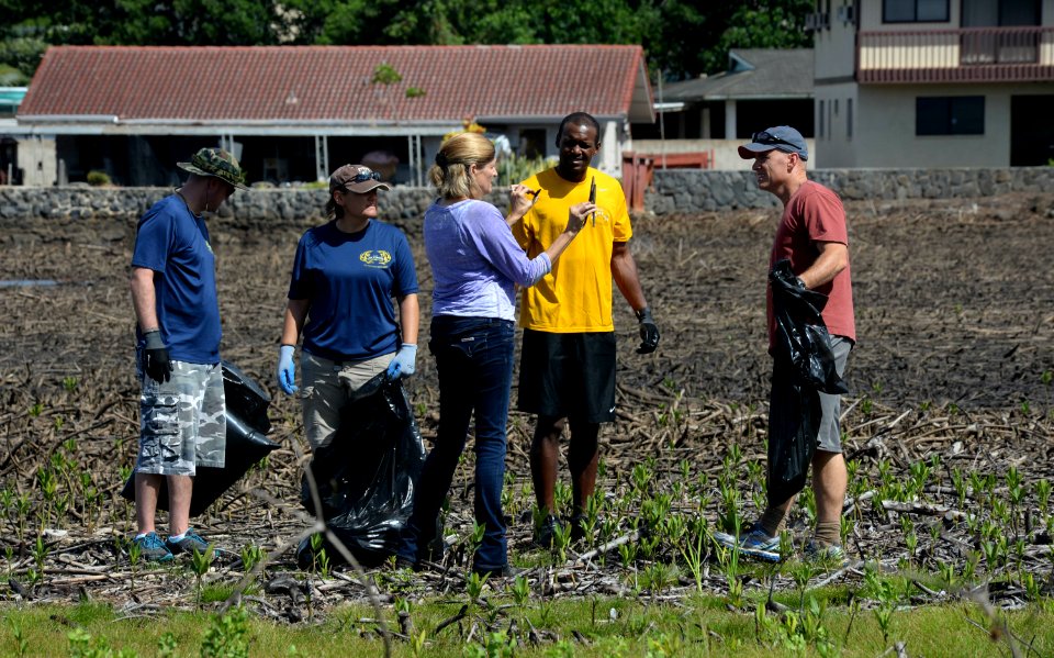 Sailors assist in a cleanup at the ancient fishpond, Loko Pa'aiau, on Oahu 150718-N-GI544-141