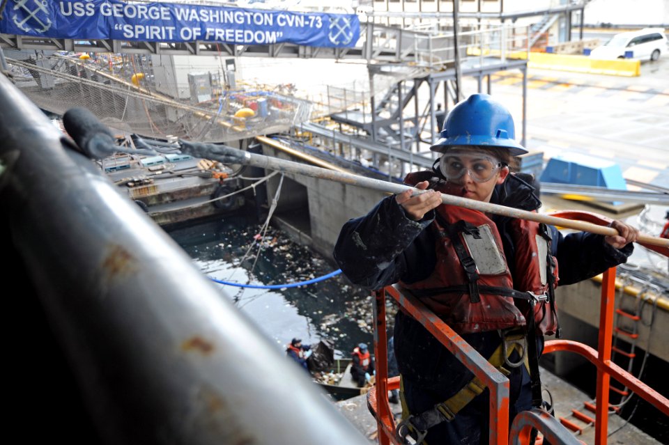 Sailor paints USS George Washington 121204-N-ZT599-064
