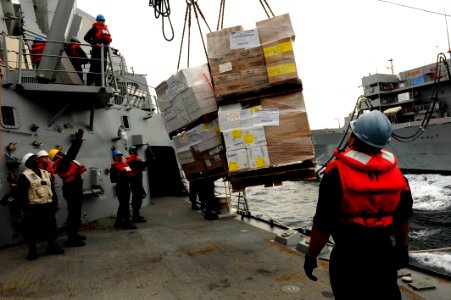 Sailors bring supplies aboard USS Farragut. (8203269772)