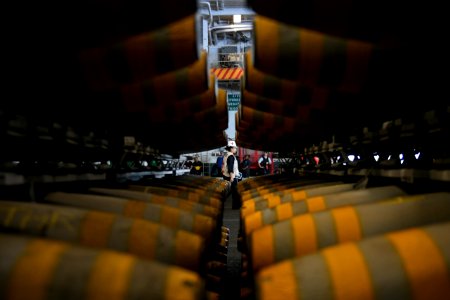 Sailor walks through the hangar bay of USS Theodore Roosevelt. (26780423837)