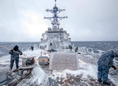 Sailors clear the ship’s forecastle of snow and ice. (32660185191)