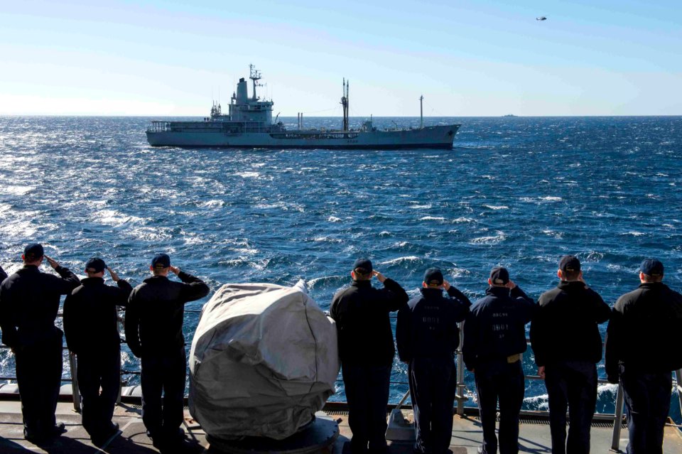 Sailors aboard USS Farragut render honors to the Portuguese navy replenishment tanker NRP Berrio. (16954013856)