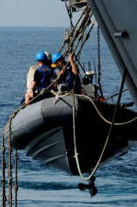 Sailors conduct operations in a rigid hull inflatable boat DVIDS233595