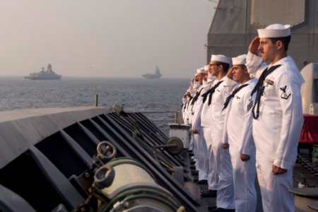 Sailors assigned to the Ticonderoga-class guided-missile cruiser USS Antietam (CG 54) render honors to a column of Indian naval vessels to mark the conclusion of India’s International Fleet Review (IFR) 2016