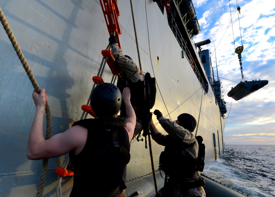 Sailors board a RHIB from USS Carter Hall. (8467234539)