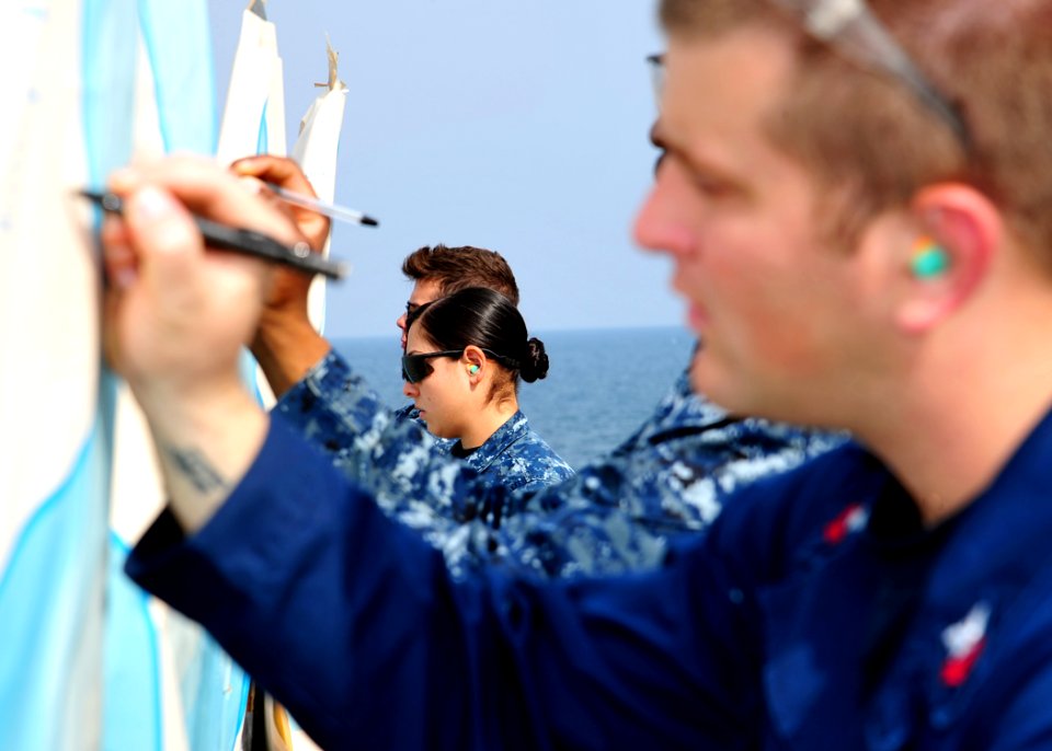 Sailors calculate scores during a pistol qualification. (8346431406)
