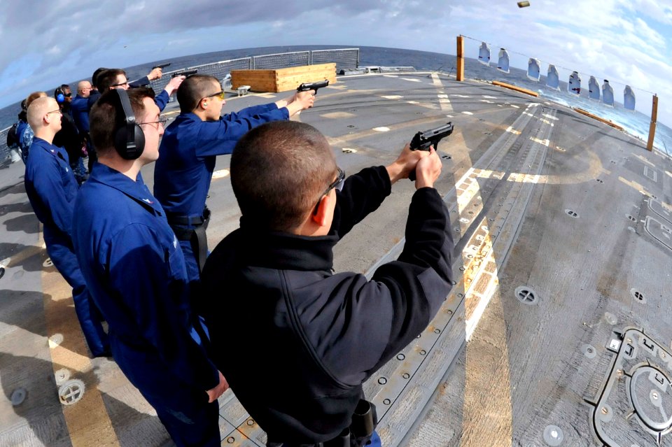 Sailors fire pistols aboard USS Jason Dunham. (8596676447)