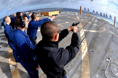 Sailors fire pistols aboard USS Jason Dunham. (8596676447)