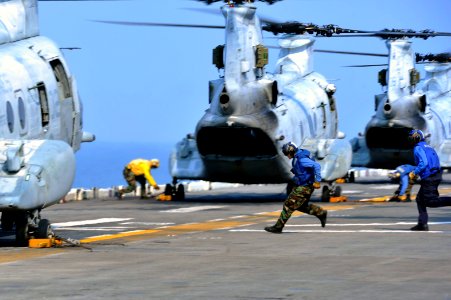 Sailors go to remove chocks and chains aboard USS Bonhomme Richard. (8489343820) photo