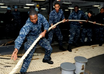Sailors heave a mooring line aboard USS Blue Ridge. (8467238383)