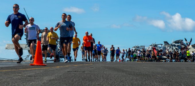 Sailors hold a sexual assault awareness run aboard USS Carl Vinson. (17256742545)