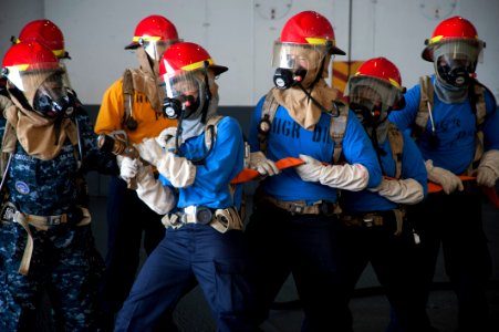 Sailors learn how to man a fire hose. (8559259501)