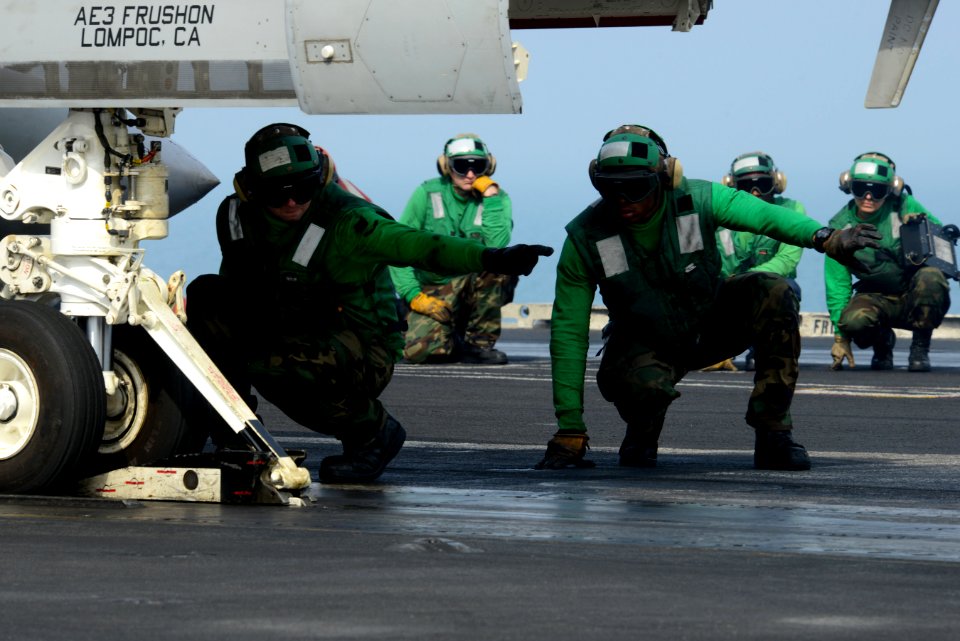 Sailors direct an aircraft aboard USS John C. Stennis. (8430022976)